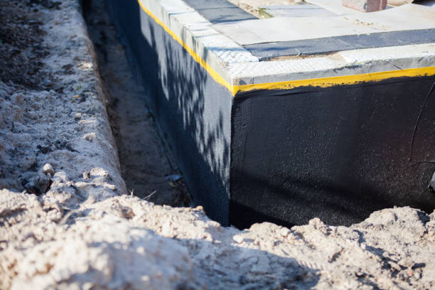 Professional Exterior Waterproofing technician working in Floral Park, NY